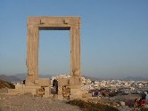 Naxos. Portara, also known as Palatia - The Temple of god Apollo, god of sun and fun.                   Naxos, Naxos hotels, Naxos rooms, naxos apartments, naxos studios, naxos accommodation, hotels in naxos, apartments in naxos. Naxos island, Cyclades, Greece. Tourist and Business Guide of Naxos. Travel to Naxos. Visit Naxos. Holidays in Naxos.